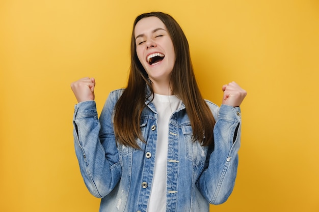 woman enjoys moment of success celebrates victory