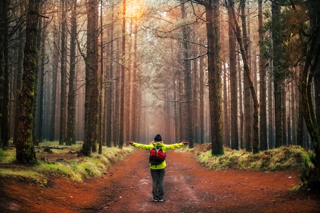 Woman enjoys the world traveling with a backpack