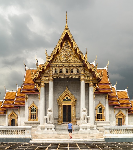 Woman entering at Thai Marble temple or Wat Benchamabophit Bangkok