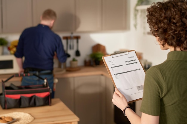 Woman examining repair service contract