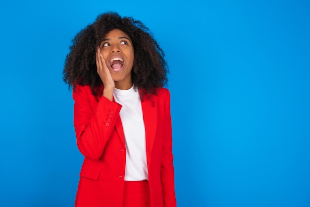 woman excited looking to the side hand on face Advertisement and amazement concept