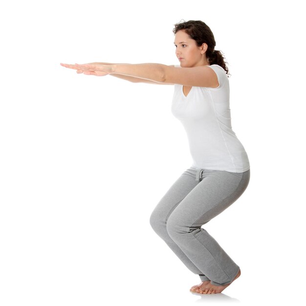 Photo woman exercising against white background