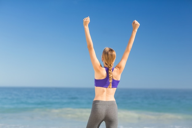 Woman exercising on the beach