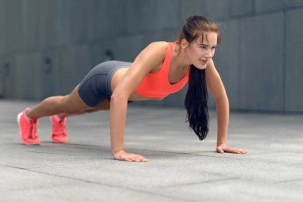 woman exercising in city