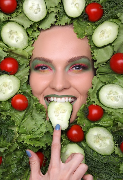 Woman face in fruits healthy nutrition and diet concept.