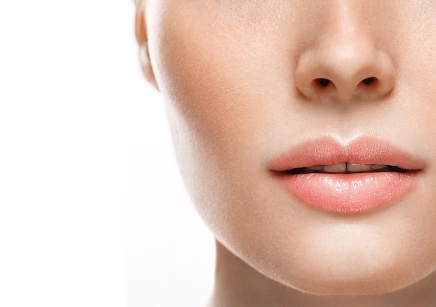 Photo woman face lips and nose studio white background close up