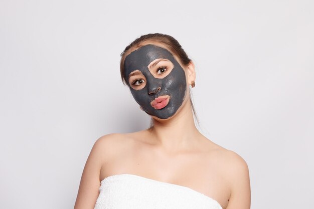 Woman Face Mask Portrait Of Beautiful Girl Removing Cosmetic Black Peeling Mask From Facial Skin Closeup Of Attractive Young Woman With Natural Makeup And Cosmetic Peel Mask On Face High Resolution