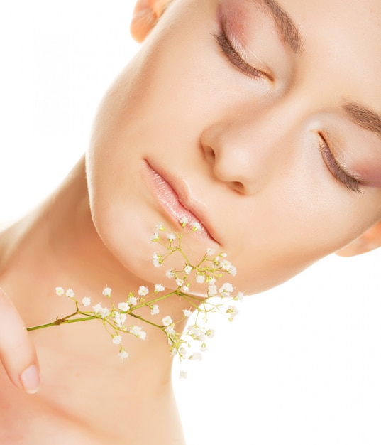 Woman face with white flowers