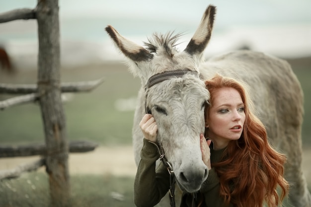 Woman on the Farm with The Donkey