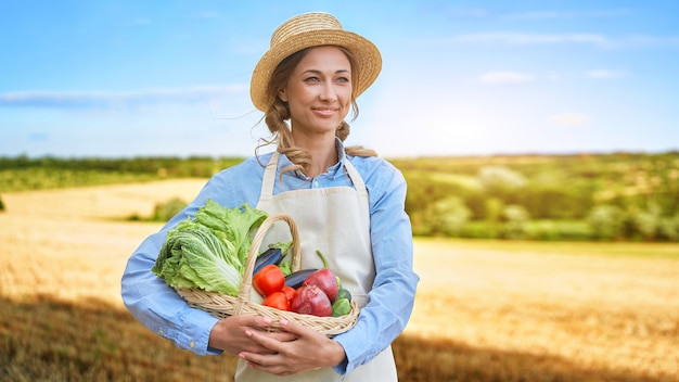 Woman farmer straw hat apron standing farmland smiling