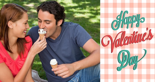 Woman feeding her friend ice cream  against happy valentines day