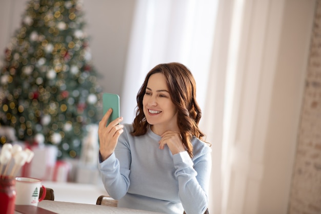 Woman feeling excited making selfie