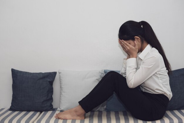 a woman in feeling exhausted and depressed 