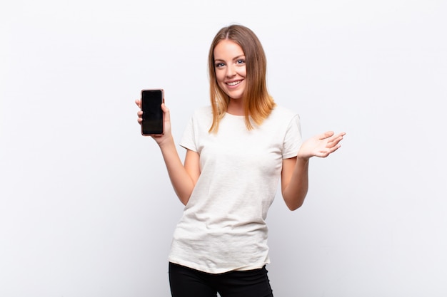 woman feeling happy, excited, surprised or shocked, smiling and astonished at something unbelievable