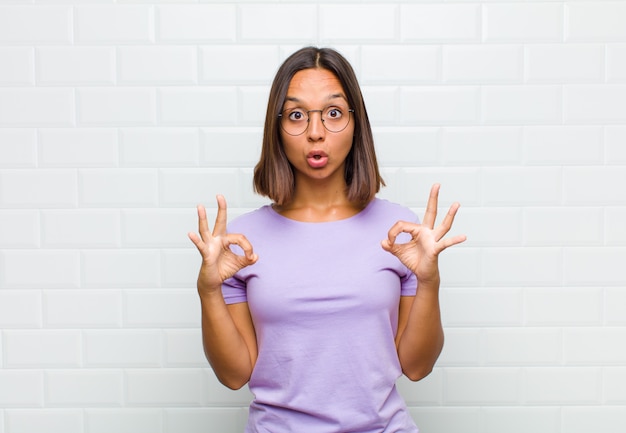 Woman feeling shocked, amazed and surprised