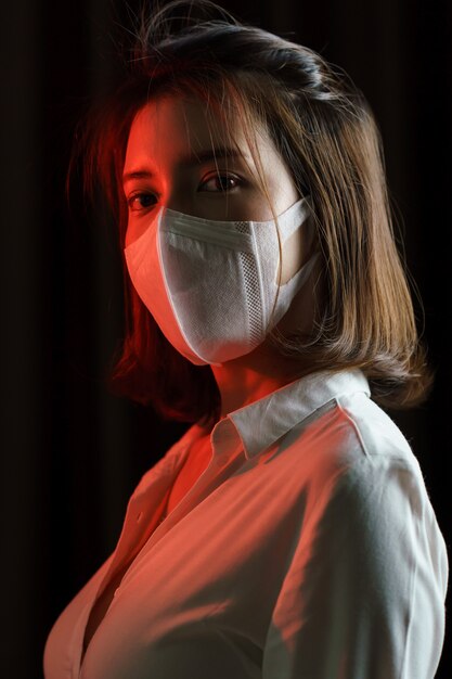 Woman feeling sick and wearing protective mask