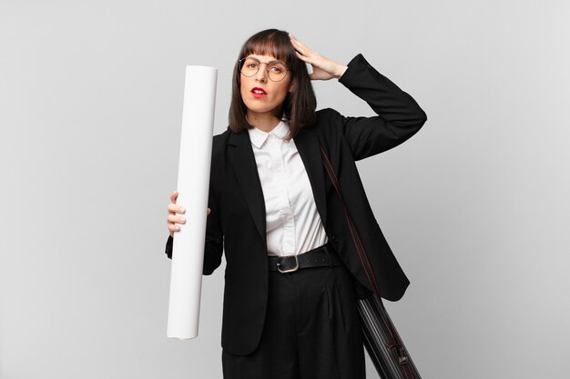 Woman feeling stressed, worried, anxious or scared, with hands on head, panicking at mistake