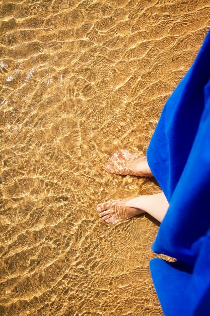 Woman feets in the sea