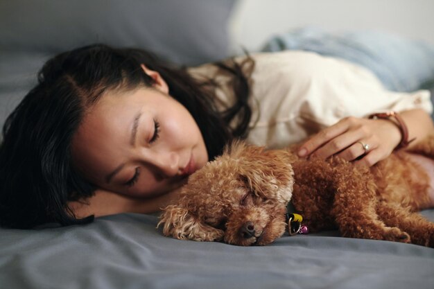 Woman fell asleep hugging dog