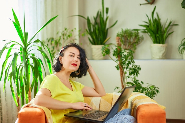 Woman female using typing on laptop keyboard working writing emails