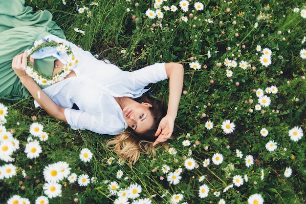 A woman in a field of chamomiles