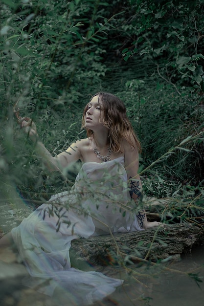 Woman on field in forest