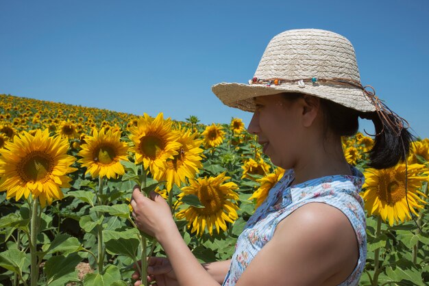 woman in field of sunflowers