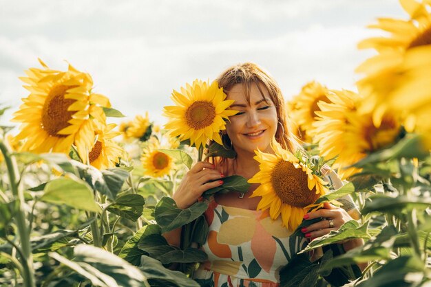 A woman in a field of sunflowers