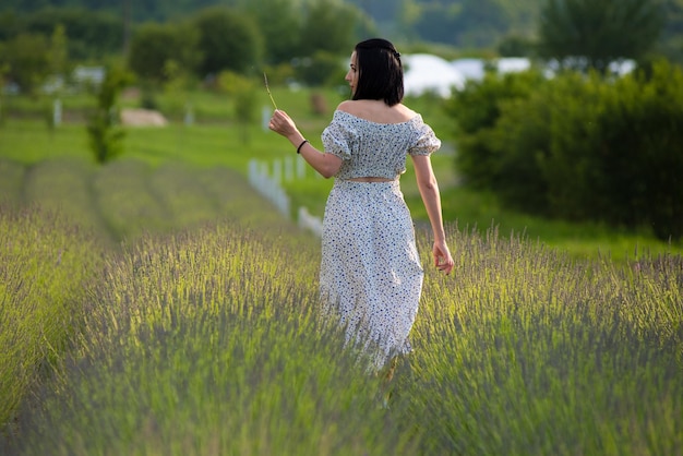 Woman in a field with a kite