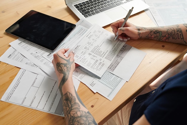 Woman filling bills and bank statements