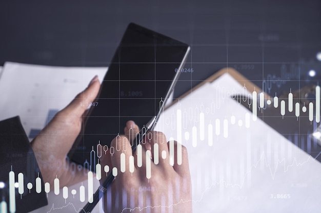 A woman financial trader in formal wear is checking the phone to sign the contract to invest money in stock market Internet trading and wealth management concept Forex hologram chart