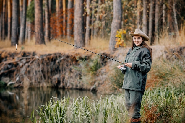 Woman fishing on the river Fishing on a spinning rod