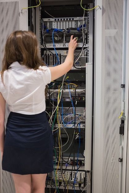 Woman fixing server wires