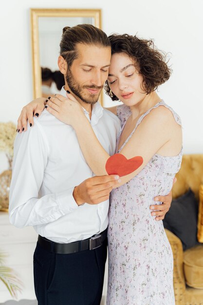 Woman in Floral Dress Hugging a Man with love Valentines Day photo