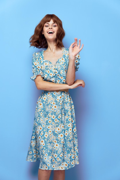 Woman in flower Joy hand near the face dress short hair