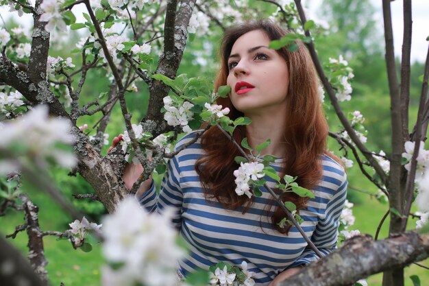 Woman and flowers tree apple