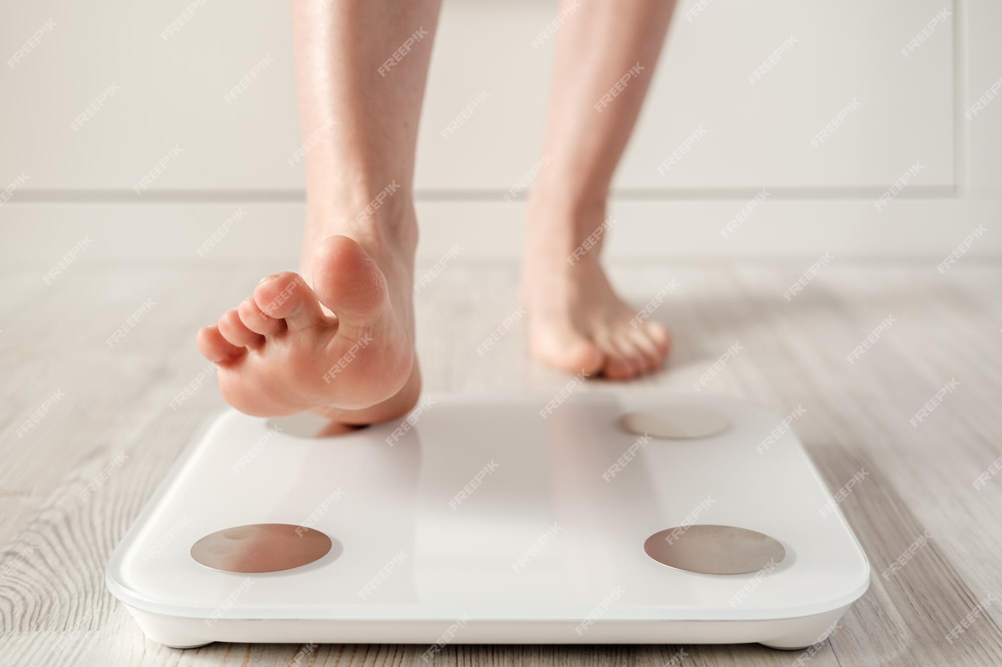 Female Bare Feet Stand On Smart Scales That Makes Bioelectric Impedance  Analysis Bia Body Fat Measurement Closeup Stock Photo - Download Image Now  - iStock