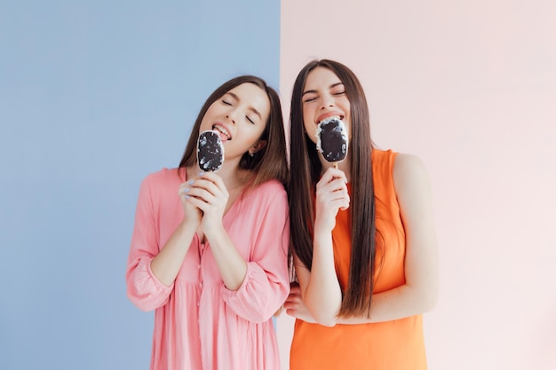 Woman friends eating ice cream together