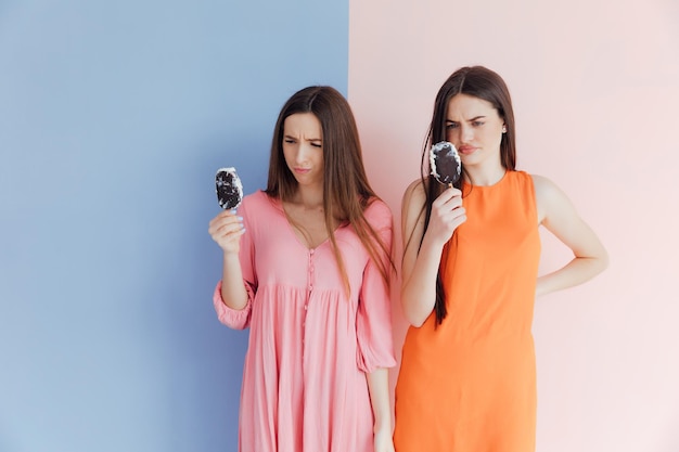 Woman friends eating ice cream together