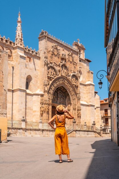 Woman from behind visiting the church of Santa Maria la Real in Aranda de Duero in the province of Burgos Spain