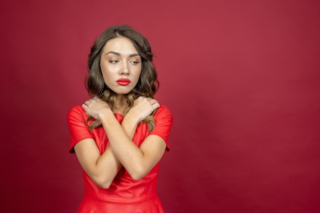 Woman frustrated on a red background