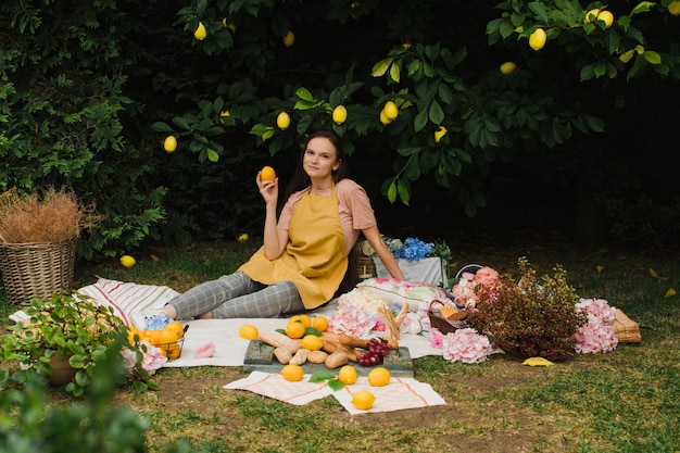 Woman in the garden on a picnic