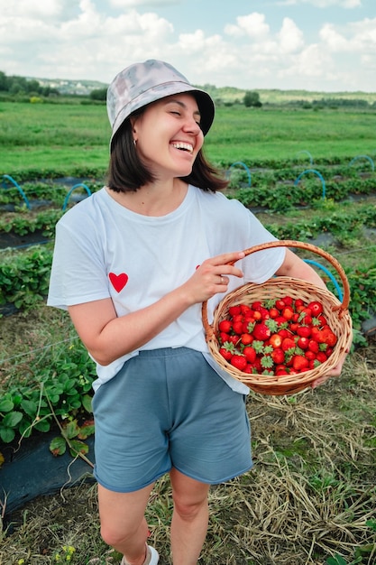 Woman gathering Strawberries at the farm