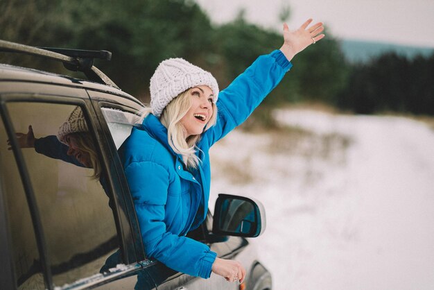 Woman gesturing though car window