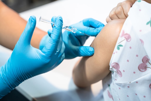 Woman get flu vaccine shot in hospital