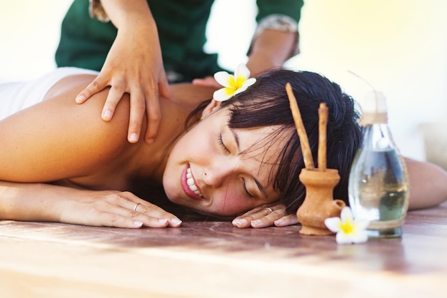 Woman getting balinese massage