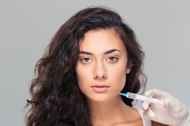 Woman getting cosmetic injection of botox
