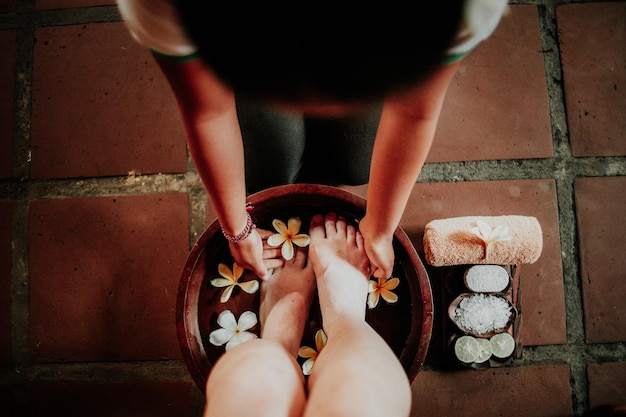 A woman getting a foot massage in a spa tub.