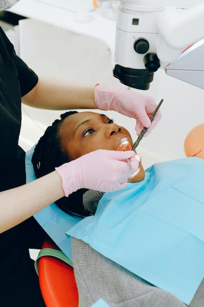 Photo woman getting her teeth checked stock photo