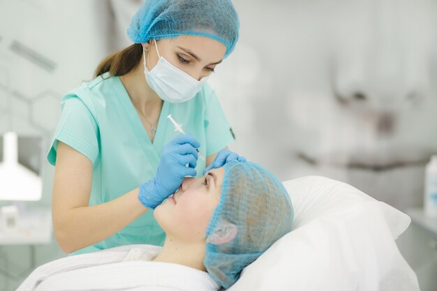 Woman getting injection in clinic